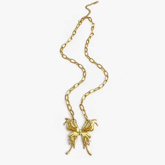 Gold necklace with a butterfly pendant on a white background