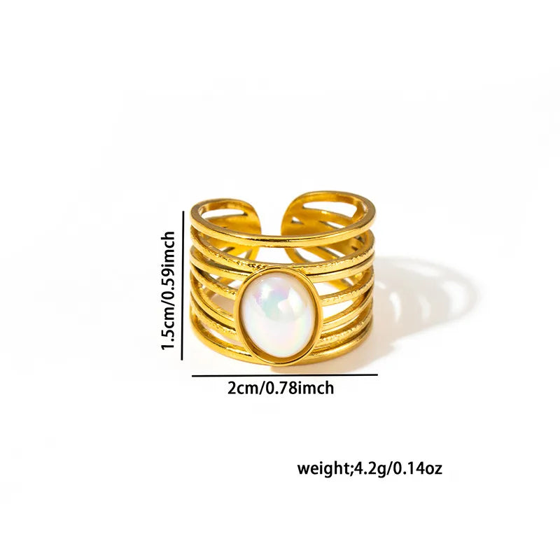Gold ring with a central gemstone, shown with measurements on a white background