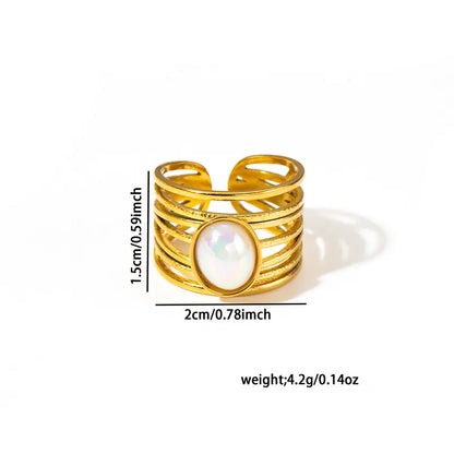 Gold ring with a central gemstone, shown with measurements on a white background